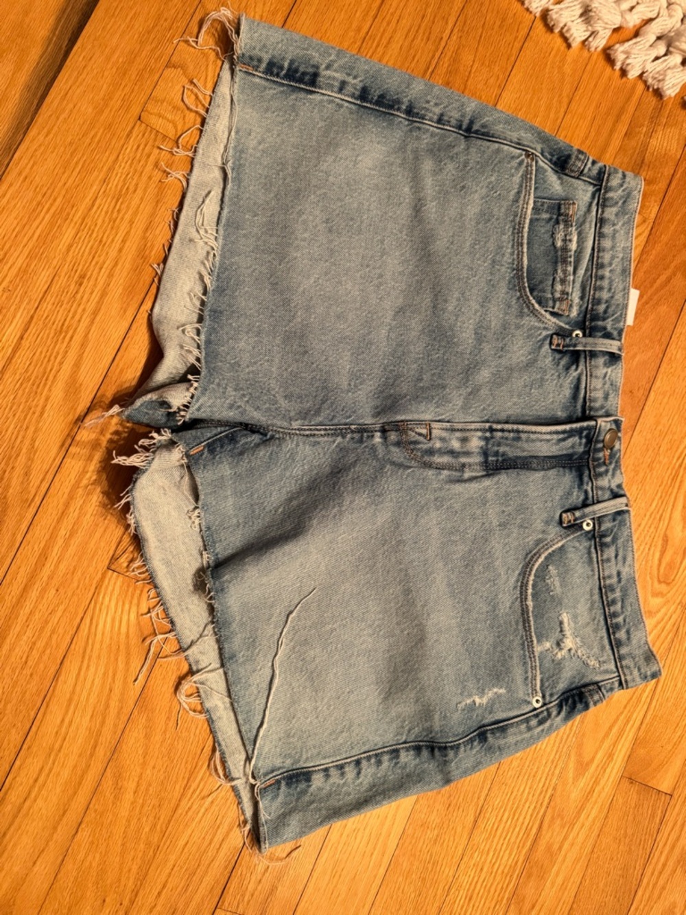 Good American Light Blue Frayed Denim Cutoff Shorts
